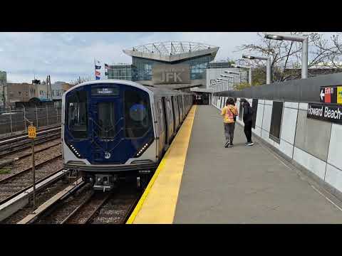 MTA: R211 and R46 A shuttle trains arrive and depart Howard Beach-JFK Airport
