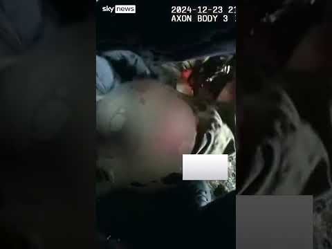 Moment driver pulled from burning car