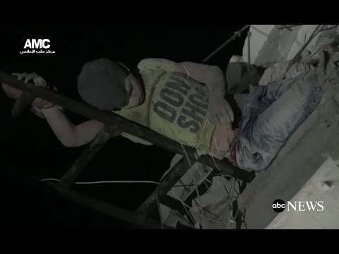 Boy Dangles from Home After Airstrike in Aleppo, Syria