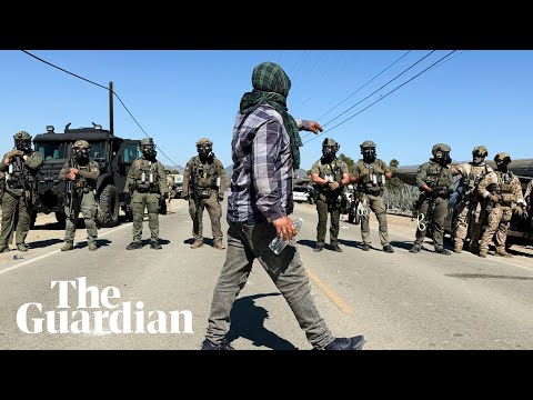 Protesters and US federal agents clash during immigration raid at California farm