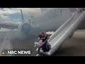 Video shows passengers evacuating American Airlines plane