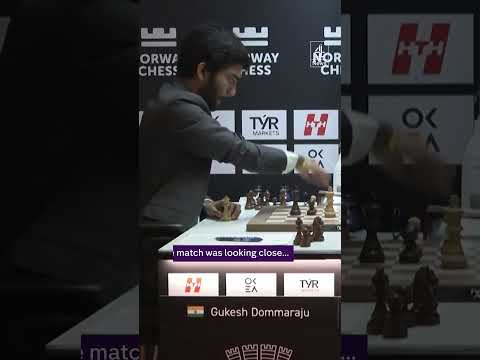Chess champion slams fist after losing match