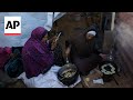 Gaza family grieving their losses share somber Ramadan meal in tent