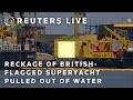 LIVE: Wreckage of British-flagged superyacht pulled out of water