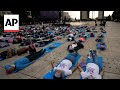 Hundreds of people in Mexico City stretch out for mass nap to commemorate World Sleep Day