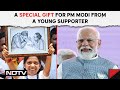 PM Modi Karnataka Visit | Mother’s Portrait At Karnataka Rally Brings Smile On PM Modi’s Face