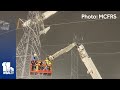 2 rescued from plane crash into power line tower