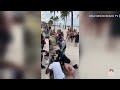Surveillance footage shows moment gunfire erupts on Florida beach - 01:28 min - News - Video