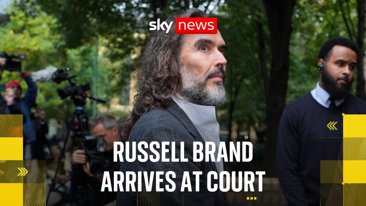 Russell Brand arrives at court ahead of trial