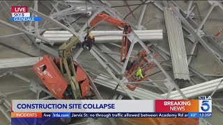 Workers trapped after construction site collapse