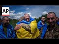 Ukrainian soldiers captured by Russia return home as part of prisoner exchange