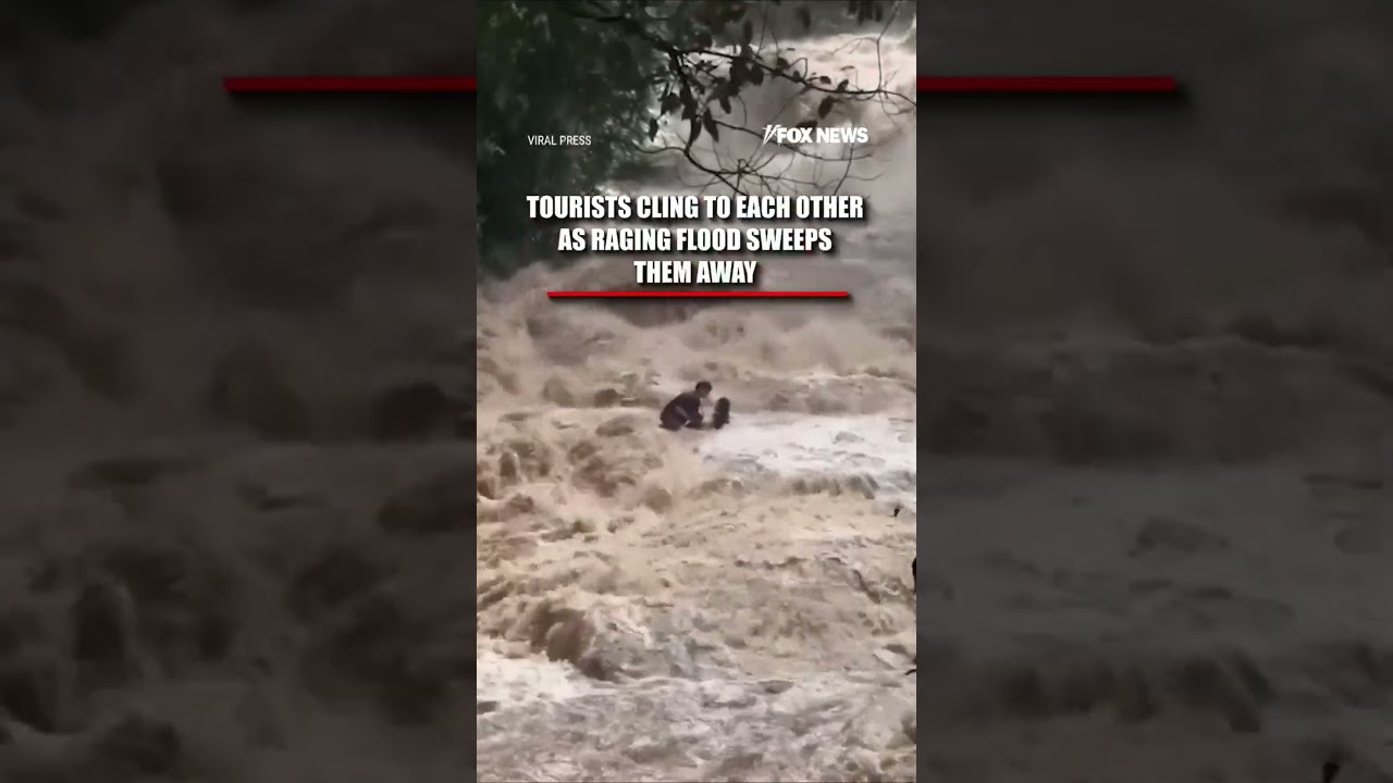 WATCH: Tourists CLING to each other as flood sweeps them away #shorts #world #news #thailand