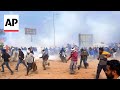 Police use tear gas against Indian farmers marching to New Delhi to demand guaranteed crop prices