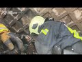 Watch Ukrainian firefighters rescue five newborn puppies after fire  - 01:00 min - News - Video