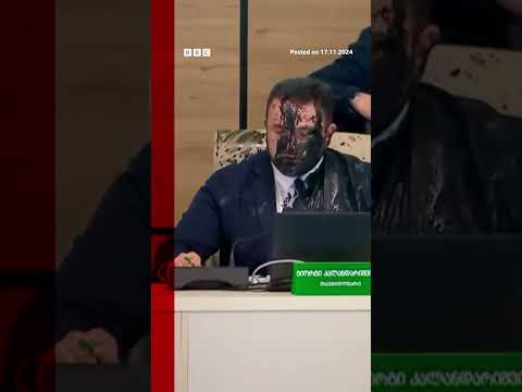 Moment Georgia election cheif doused in paint by opposition official. #Georgia #BBCNews