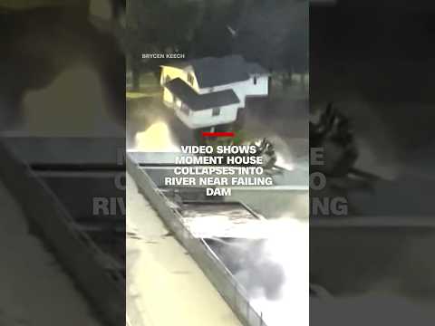 Video shows moment house collapses into river near failing dam