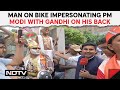 PM Modi | Man On Bike Impersonating PM Modi With Gandhi On His Back Seat