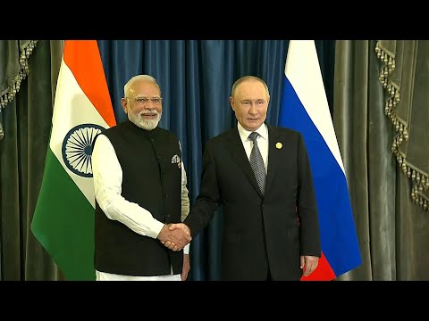 Putin hails Russia-India ties as he meets Modi in China | AFP