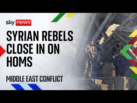 Syrian rebels close in on central city of Homs as thousands flee lightning advance