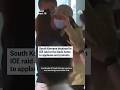 South Koreans detained in ICE raid arrive back home to applause and protests