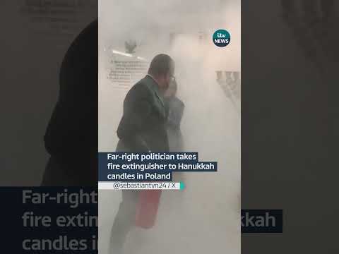 Far-right politician takes a fire extinguisher to Hanukkah candles  #itvnews #news #poland #hanukkah