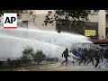 Chilean police use water cannons to disperse May Day march protesters