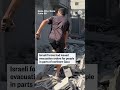 Video shows the moment an apparent Israeli airstrike hit a building as people were evacuating