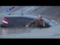 Reporter Saves Driver From Flood- Watch video
