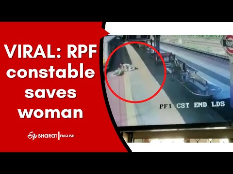 RPF constable saves woman from slipping under moving train, CCTV footage RPF constable saves woman from slipping under moving train, CCTV footage