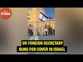 Watch: UK Foreign Secretary runs for cover after siren goes off as rockets fire in Israel