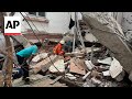 Rescuers search through rubble of collapsed buildings after earthquake in Myanmar