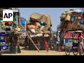 Afghan families begin their return as Pakistan warns of mass deportations of refugees