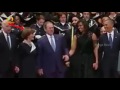 Former US president George W. Bush dances along with Obama couple