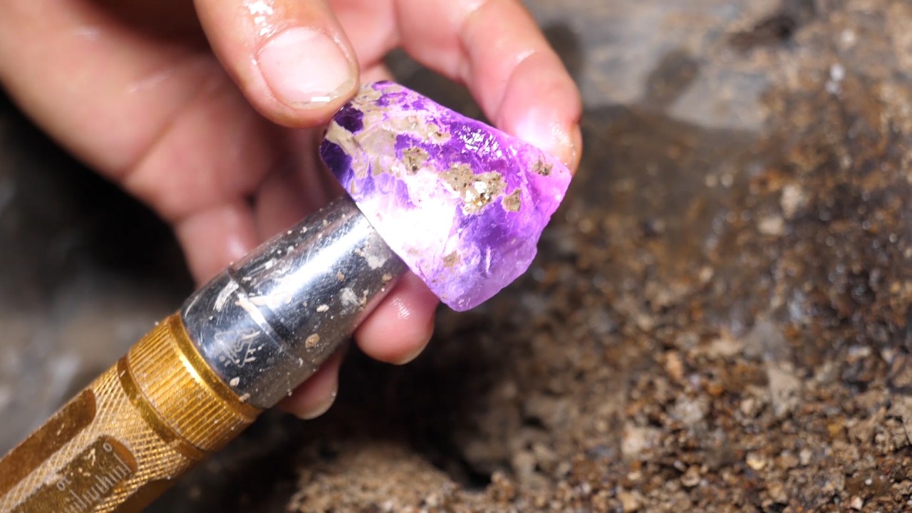 The boy found several precious crystals in an open area near a garbage dump.