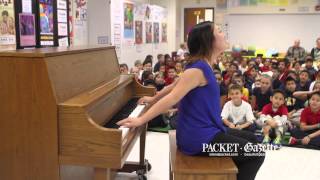 Carissa Kim, a competitor in the 2014 Hilton Head International Piano Competition, of Los Angeles, Calif. visited the students at M. C. Riley Elementary School on Friday, March 14 to perform a few songs on the piano and to answer their questions.