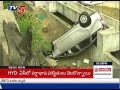 Car overturns; falls into Musi