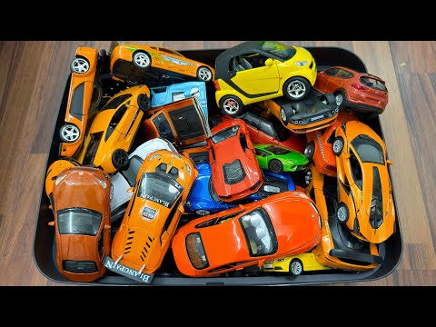 Box Full Of Orange Cars - Låda Fullt Av Oranga bilar 