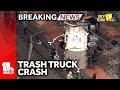 Trash truck falls from bridge in Baltimore crash