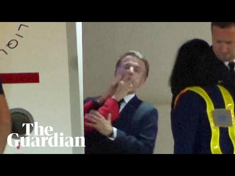 Moment Macron's wife pushed him in the face as they land in Vietnam