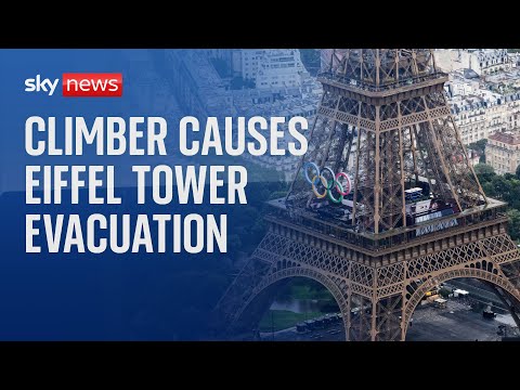 Eiffel Tower evacuated after shirtless man climbs landmark