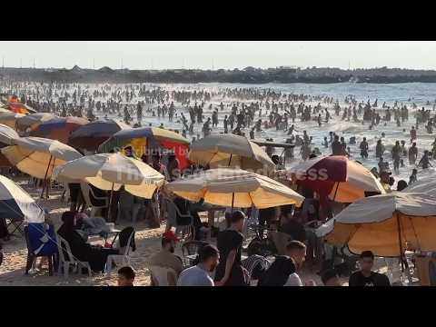 Palestinians flock to the beach in Gaza City to escape the sweltering summer heat