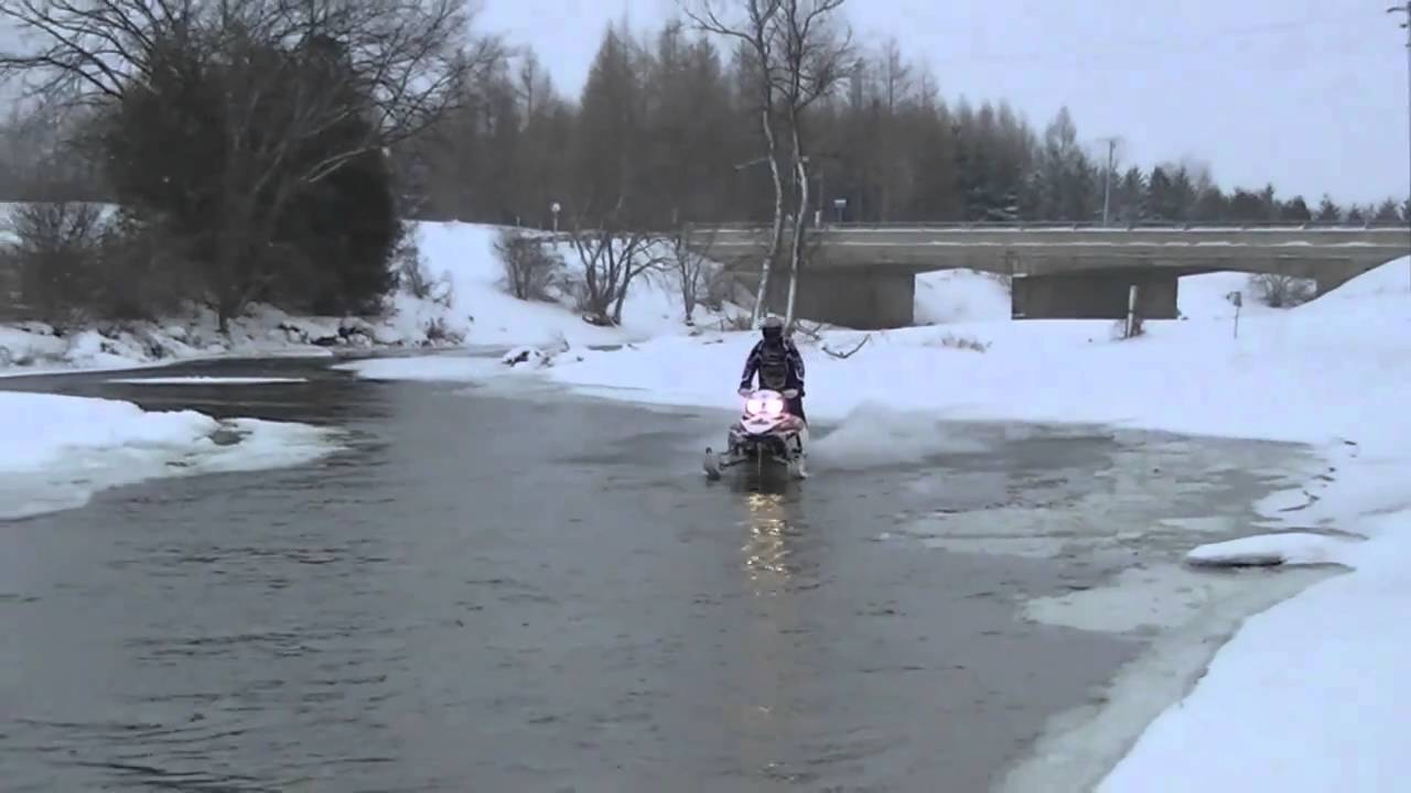 Snowmobiles Skipping Water 99