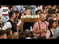 Crowds stream into Oktoberfest grounds as Munich beer festival opens