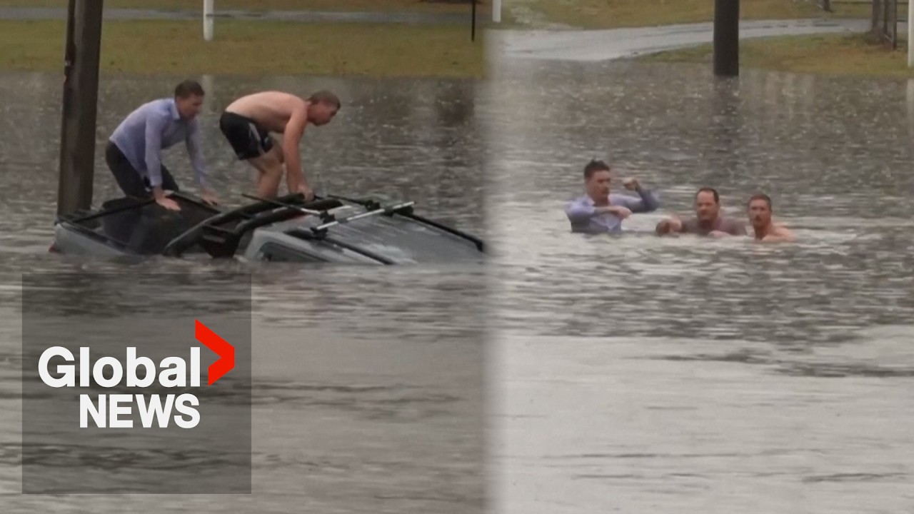 Australian reporter pulls man from sinking car while reporting on floods