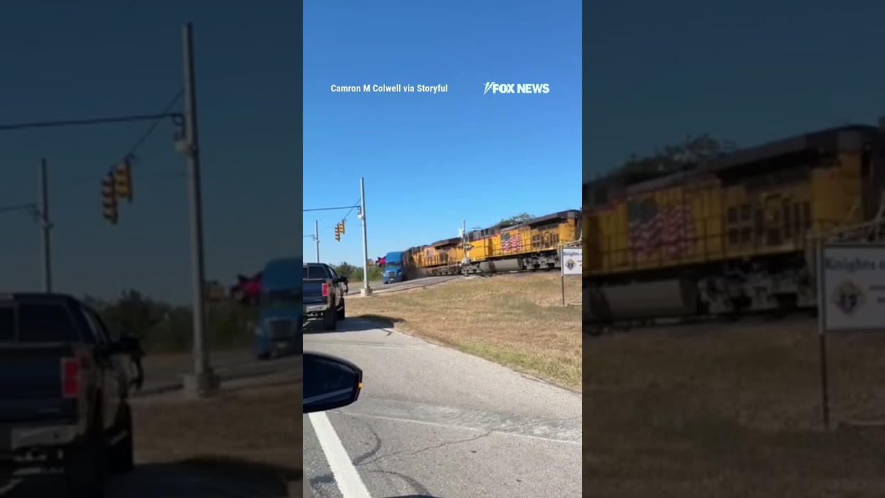 'GET OUT OF THE TRUCK!': Driver escapes before train barrels into semi-trailer truck #shorts #usa