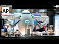 Robot baristas, AI chefs cause stir at CES 2024