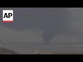 Large smoke plume climbs into sky over Gaza Strip