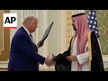 Saudi Arabias crown prince and Trump sign agreements in his first Middle East stop