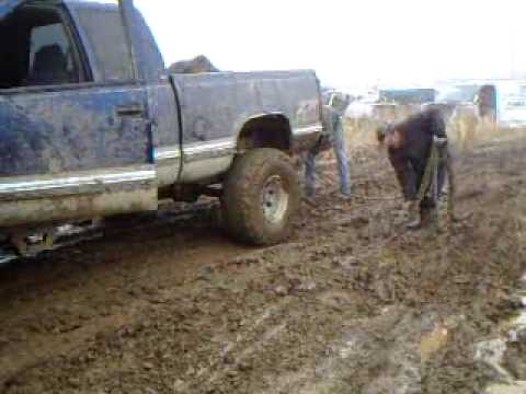 Chevy pulling ford out of mud #7