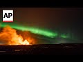 Iceland volcano erupts amidst Northern Lights display | AP EXCLUSIVE